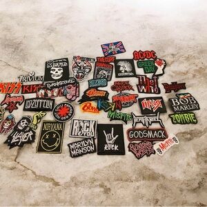 50 rock, metal and punk iron patches unused.